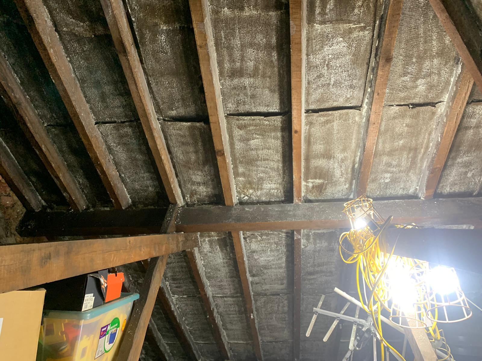 Work lights in a loft, with multi-foil insulation fitted under the rafters